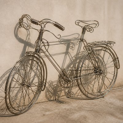 bicyle resting against a wall — Wire Art Style