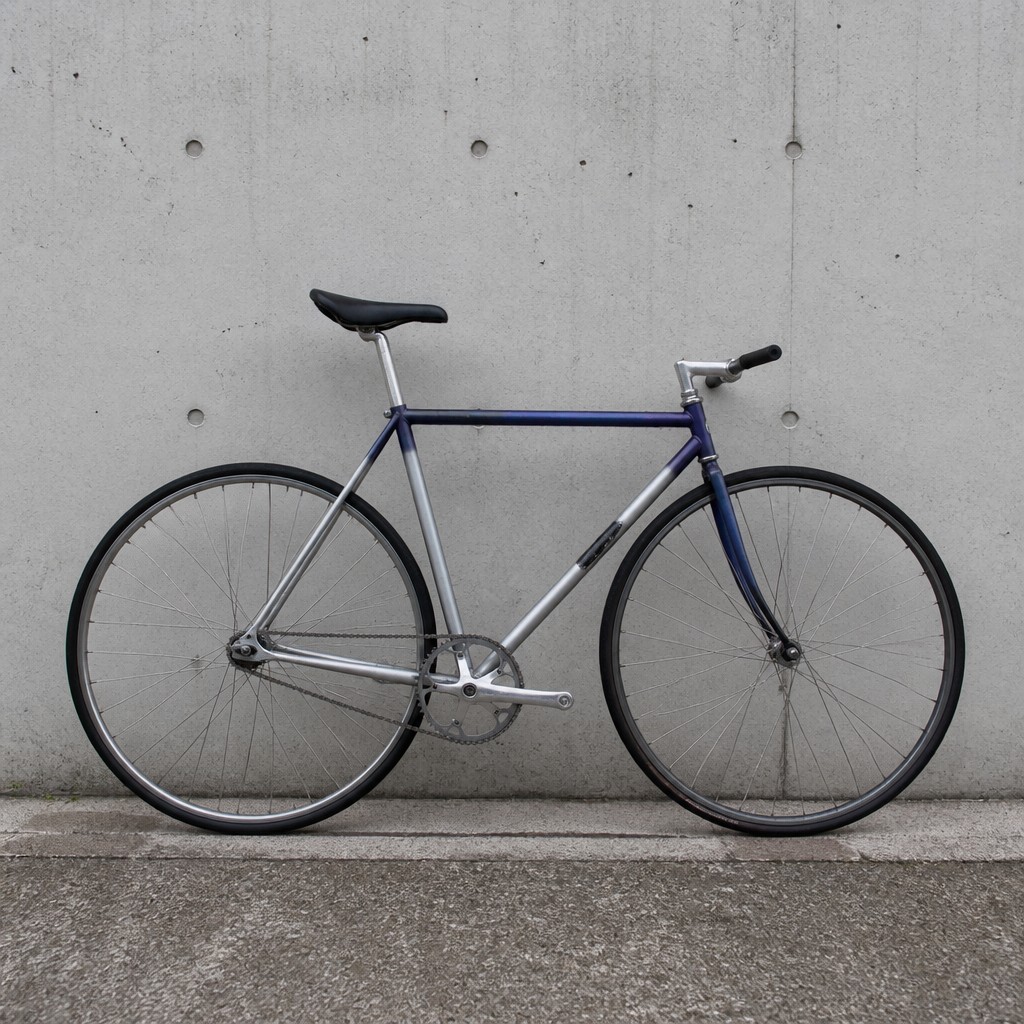 bicyle resting against a wall