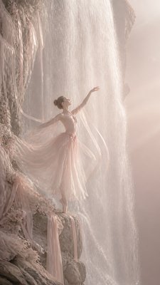 towering waterfall cascading down a cliff