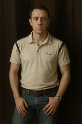 a man standing in front of a wooden wall