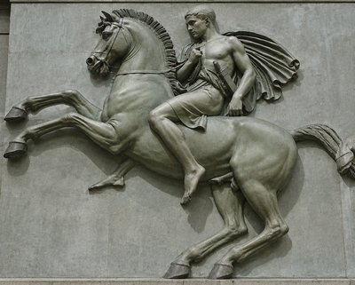 a statue of a man riding on the back of a horse