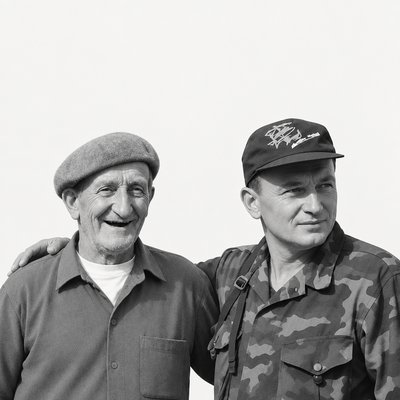 a couple of men standing next to each other