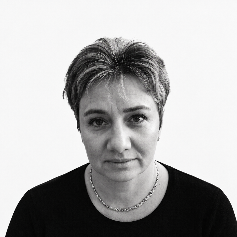 a black and white photo of a woman with short hair