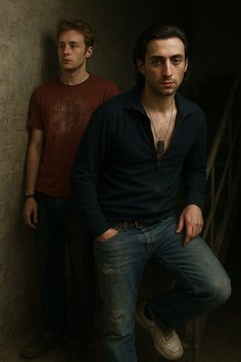 two men standing next to each other in a room