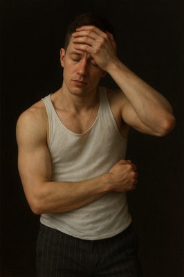 a man with his hands on his head