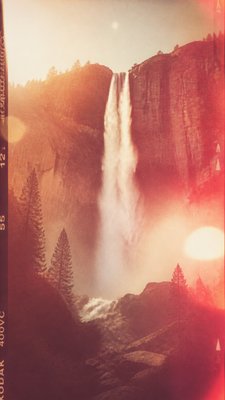 towering waterfall cascading down a cliff