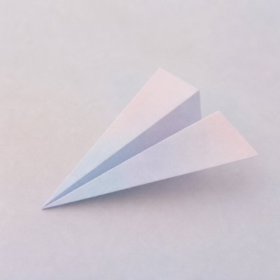 a paper plane, clean minimal composition on a plain background, no text