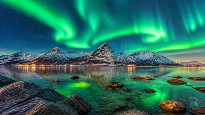 a flowing aurora over snowy peaks, wide sweeping composition, no people, no text