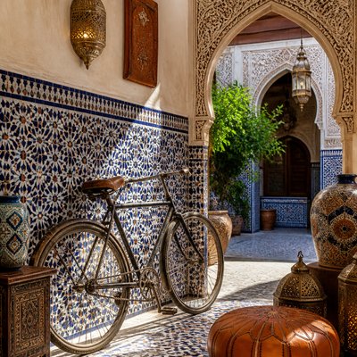bicyle resting against a wall