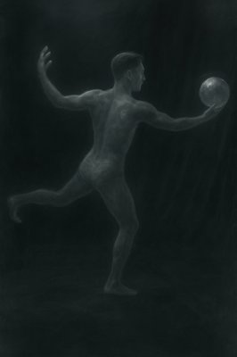 a black and white photo of a man playing with a ball