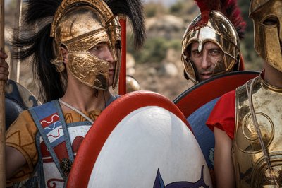 a group of men dressed in roman armor
