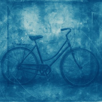 bicyle resting against a wall