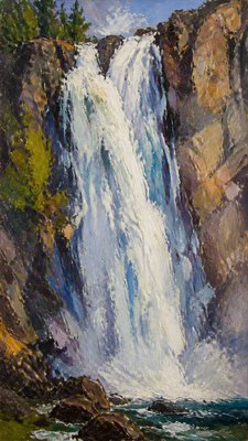 towering waterfall cascading down a cliff