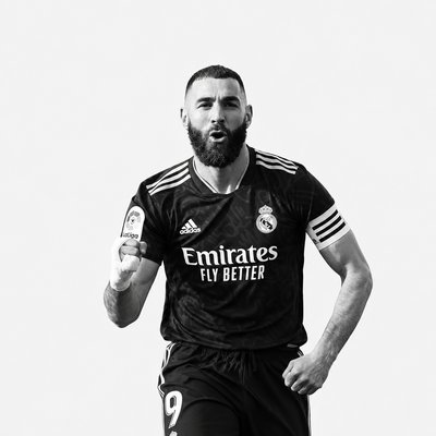 a man with a beard wearing a soccer uniform