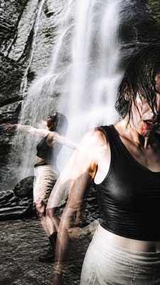 towering waterfall cascading down a cliff