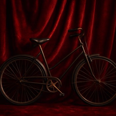 bicyle resting against a wall