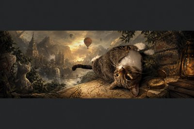 a cat laying on top of a table next to a painting