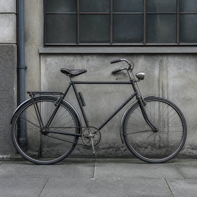 bicyle resting against a wall — New Objectivity Art Style