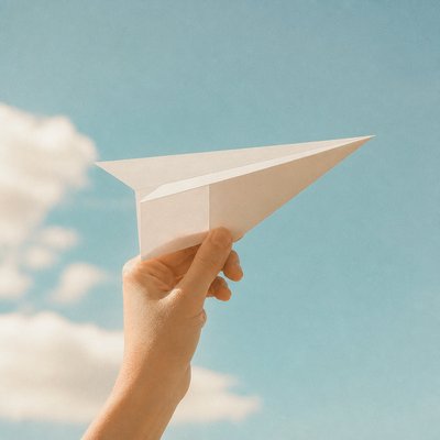 a paper plane, clean minimal composition on a plain background, no text