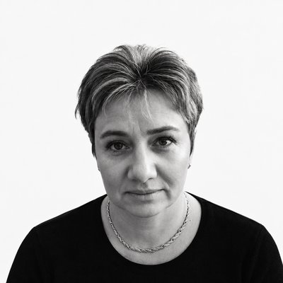 a black and white photo of a woman with short hair