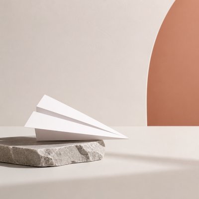 a paper plane, clean minimal composition on a plain background, no text