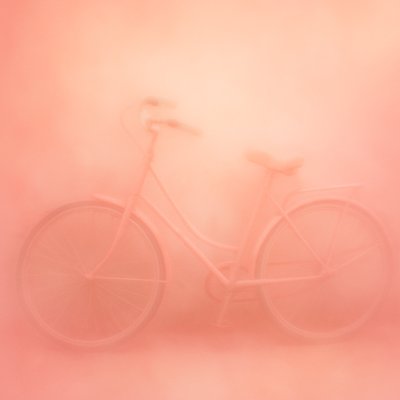 bicyle resting against a wall