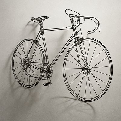 bicyle resting against a wall