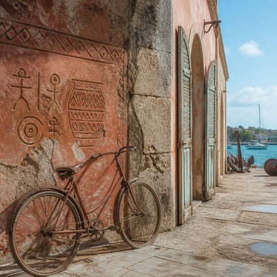 bicyle resting against a wall — Antiguan Art Style