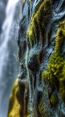 towering waterfall cascading down a cliff