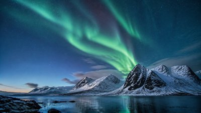 a flowing aurora over snowy peaks, wide sweeping composition, no people, no text