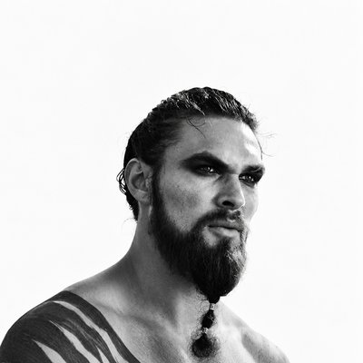 a black and white photo of a man with a beard