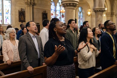 diverse group of Christians worship together
