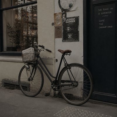 bicyle resting against a wall