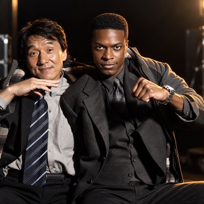 a couple of men sitting next to each other