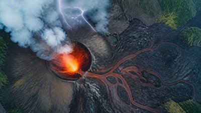 an erupting volcano with lightning strikes, dramatic wide composition, no text