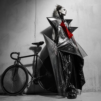 bicyle resting against a wall