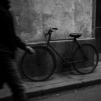 bicyle resting against a wall