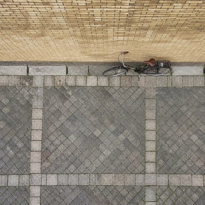 bicyle resting against a wall