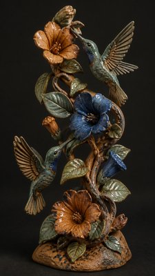 a climbing vine of flowers and hummingbirds on a dark background, tall wrapping composition, no text
