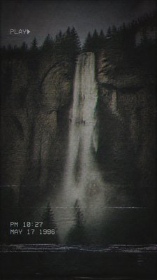 towering waterfall cascading down a cliff