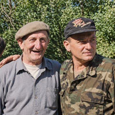a couple of men standing next to each other