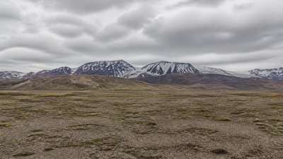 sweeping panoramic landscape with a dramatic sky