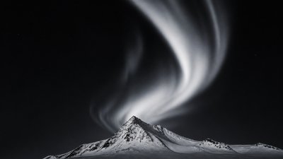 a flowing aurora over snowy peaks, wide sweeping composition, no people, no text