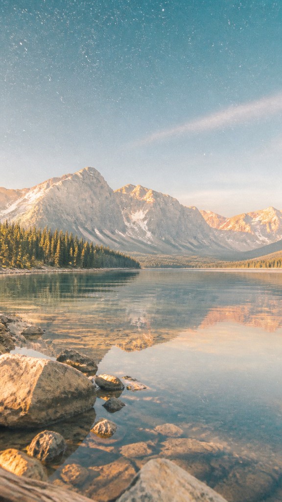 a tranquil mountain lake beneath a starry night sky, no people, no text