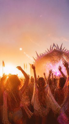 a live music scene with a glowing stage and silhouetted crowd, energetic vertical composition with open space at the top, no text