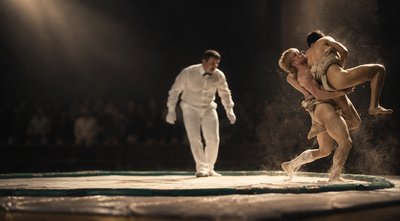 a couple of people that are standing on a stage