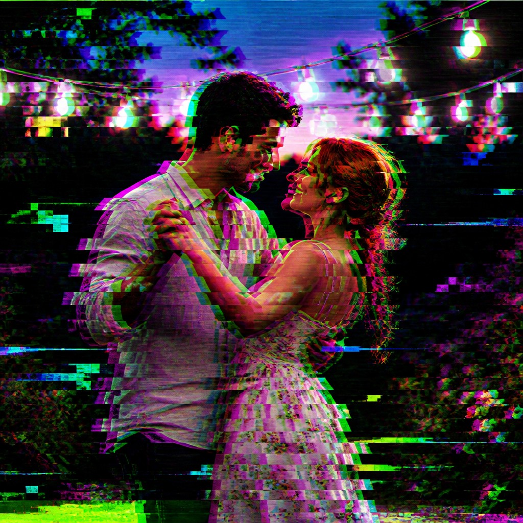 an original couple dancing under string lights in a garden at dusk: a man with short black hair in a linen shirt and a woman with braided red hair in a summer dress