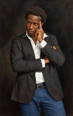 a man in a suit posing for a picture