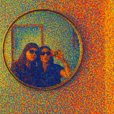 two people taking a selfie in a mirror