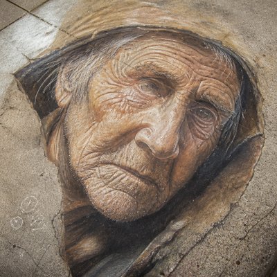 close-up portrait of an elderly person with expressive weathered features